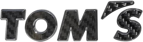 Toms Emblem Carbon – 08233-TS004 – supplier image